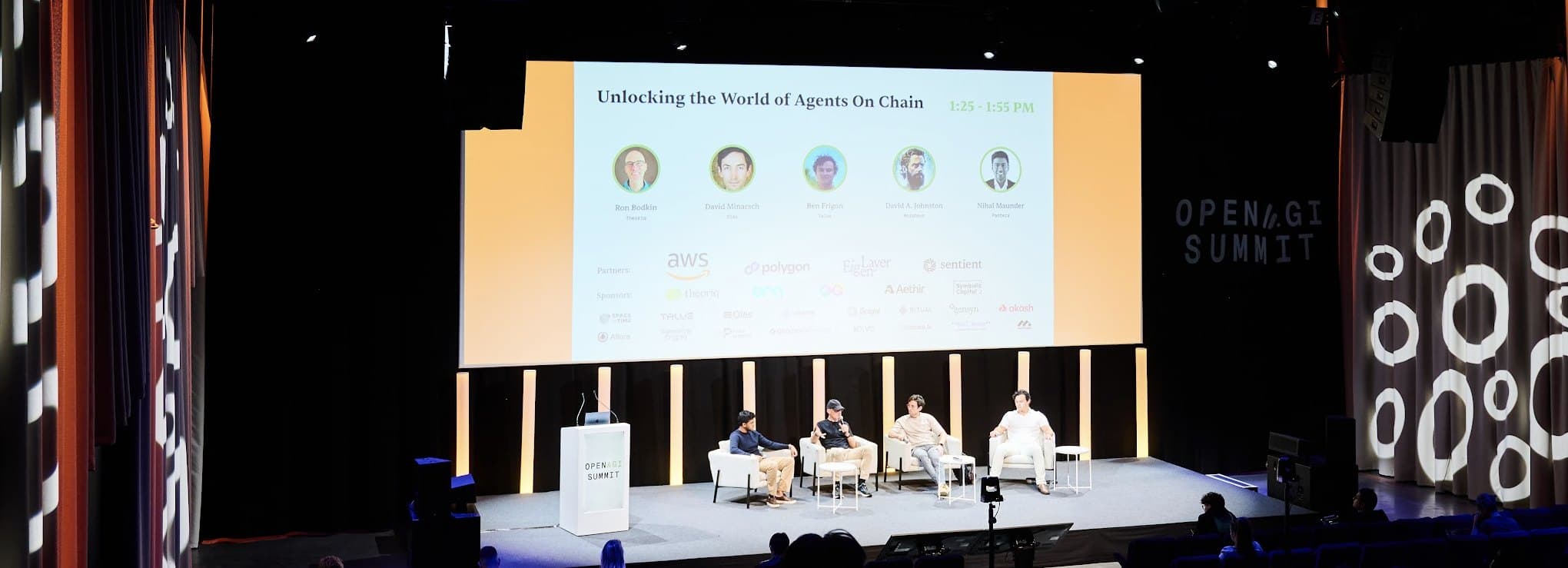 Panel discussion on the Open AGI Summit stage